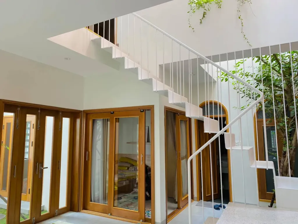 Cầu thang - A House - Ngôi nhà 2 tầng bình yên với vật liệu mộc mạc cùng giếng trời thông gió tự nhiên   | Space T