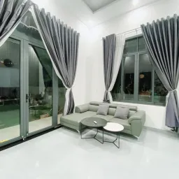 Phòng khách - Bỏ phố về quê xây nhà vườn thiết kế hiện đại, tối giản như “biệt thự mini” 