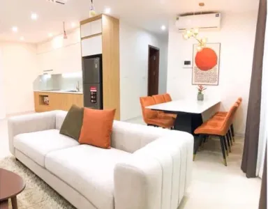 Căn hộ 99m2 bố trí nội thất hợp lý với sắc cam - trắng trang nhã hiện đại